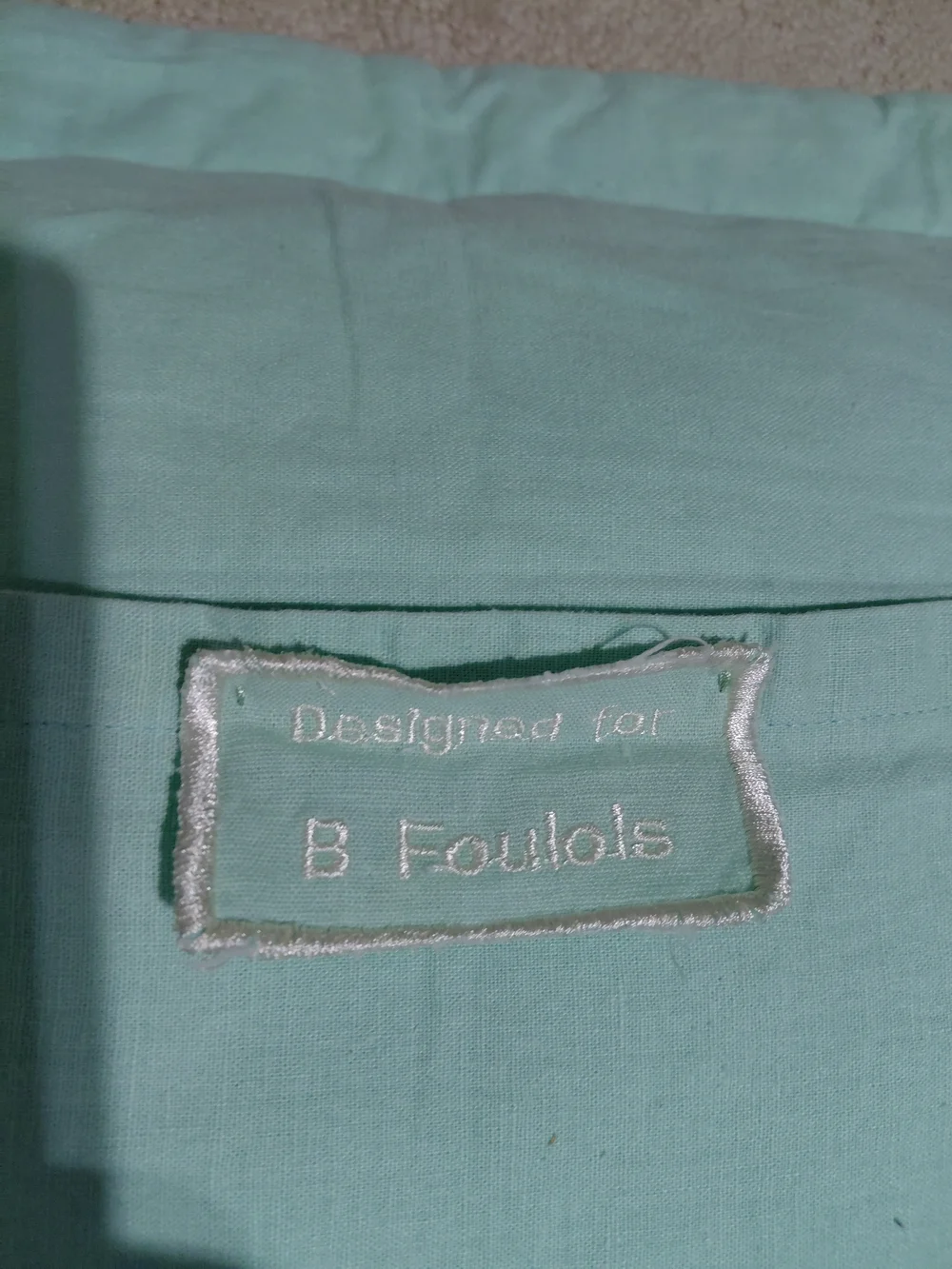 Embroidered Aqua Decorative Pillow with Red Floral Motif